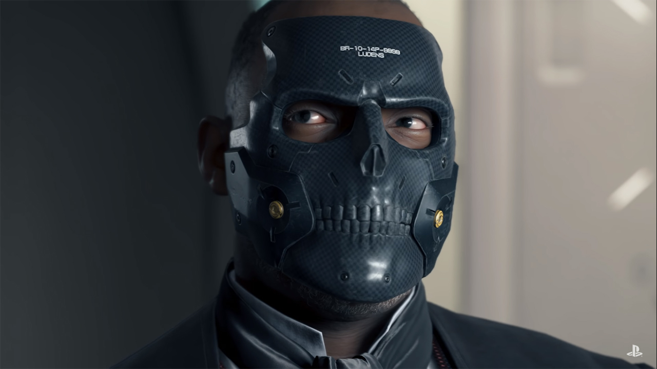 Die-Hardman from Death Stranding. He’s a black man wearing a black skull-shaped mask.