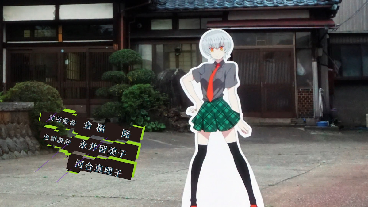 A standee of a character against a live background in Gatchaman Crowds.