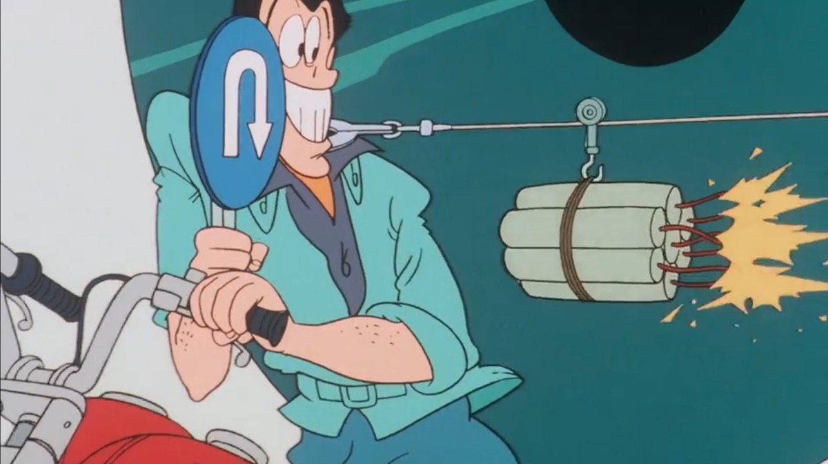 Lupin holds up a U-turn sign, causing a stick of dynamite on a string to reverse course.