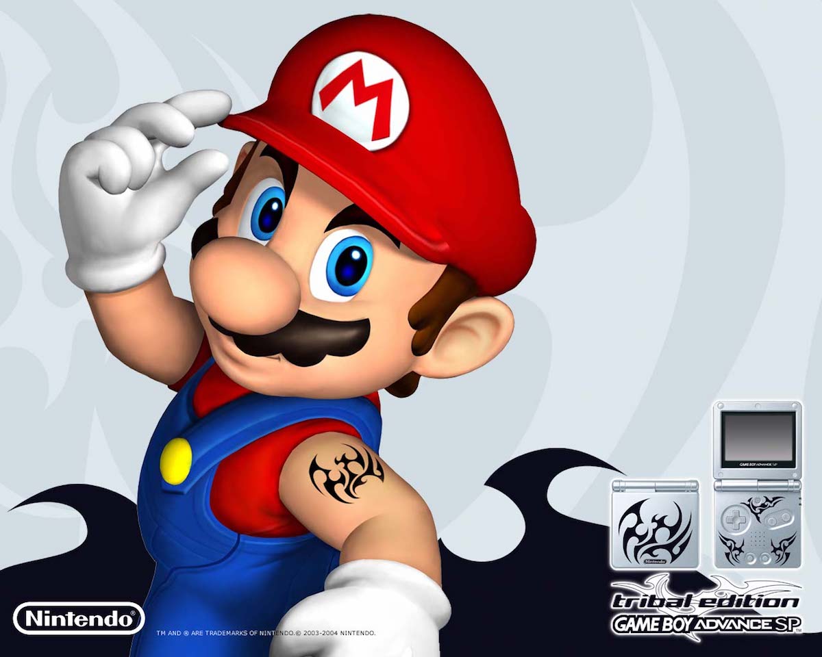 Mario showing off a tribal tattoo on his upper arm.