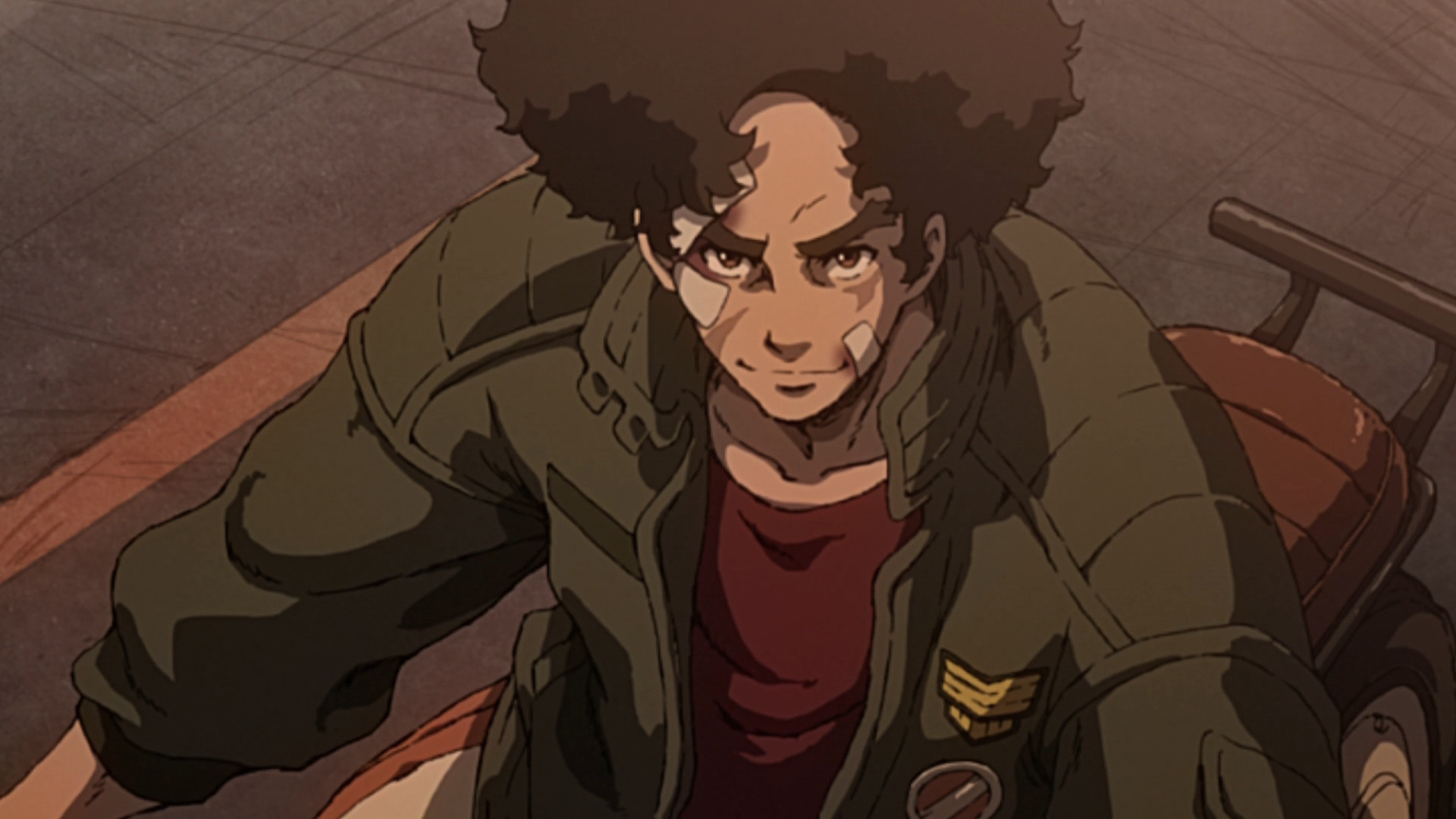 Joe from Megalobox on a motorcycle, smiling.