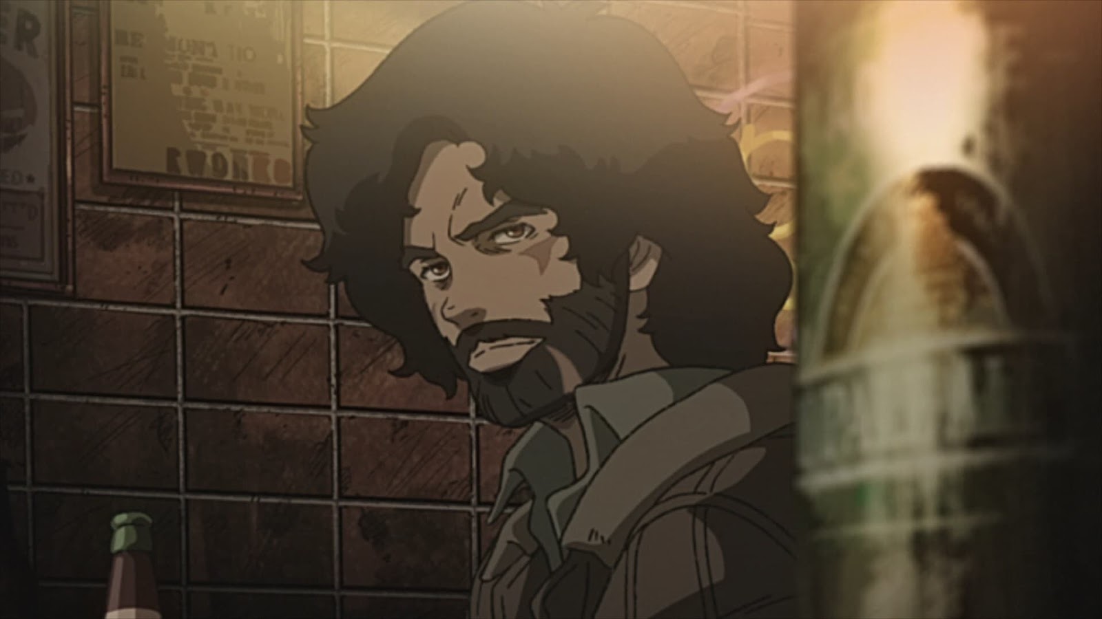 Joe from Megalobox glancing to the side while frowning. He has long hair and a full beard.
