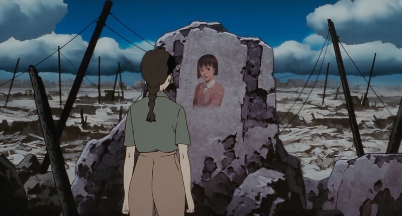 Chiyoko, as a young woman, staring at the bombed out rubble of her house, where a painting of her as a teenager is still affixed to the wall.