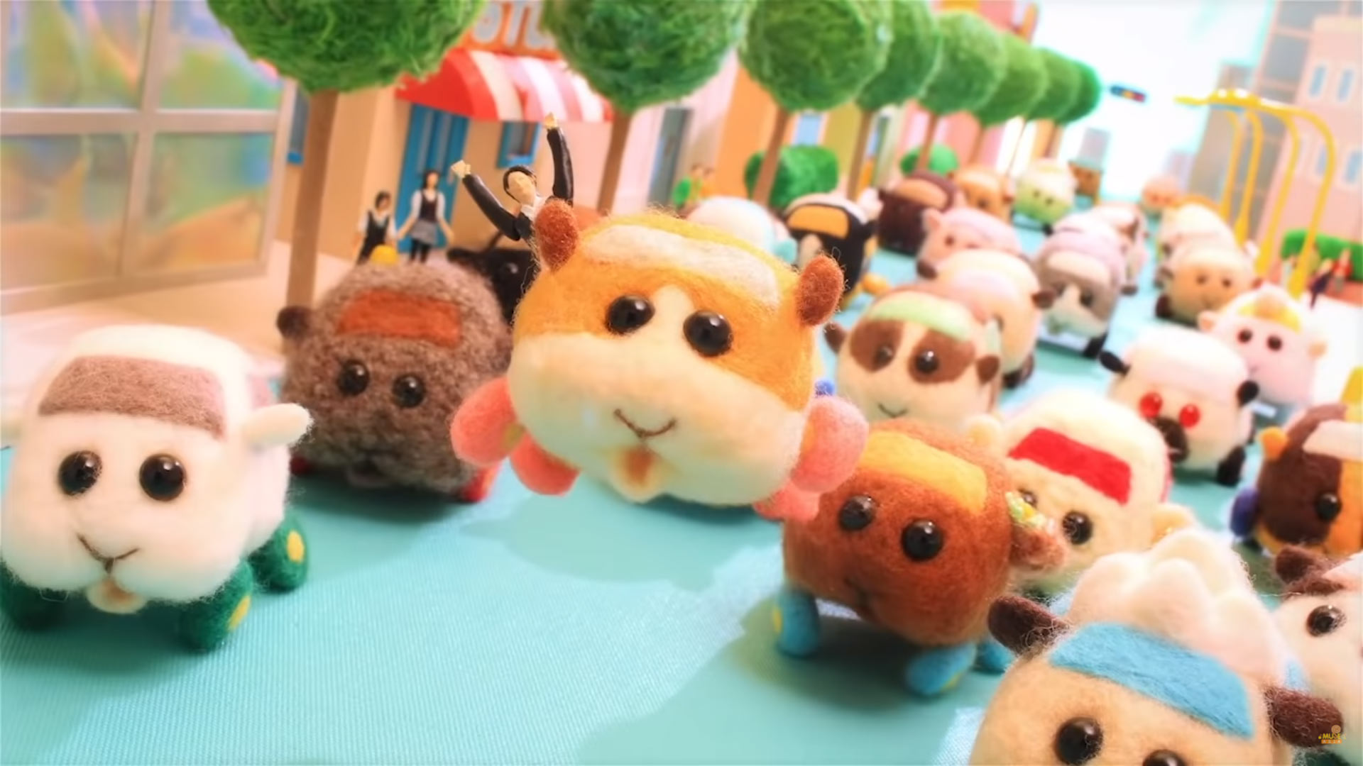 A crowd of Molcars, plush guinea pig cars, rushing toward the camera. The orange and white one is leaping up happily.