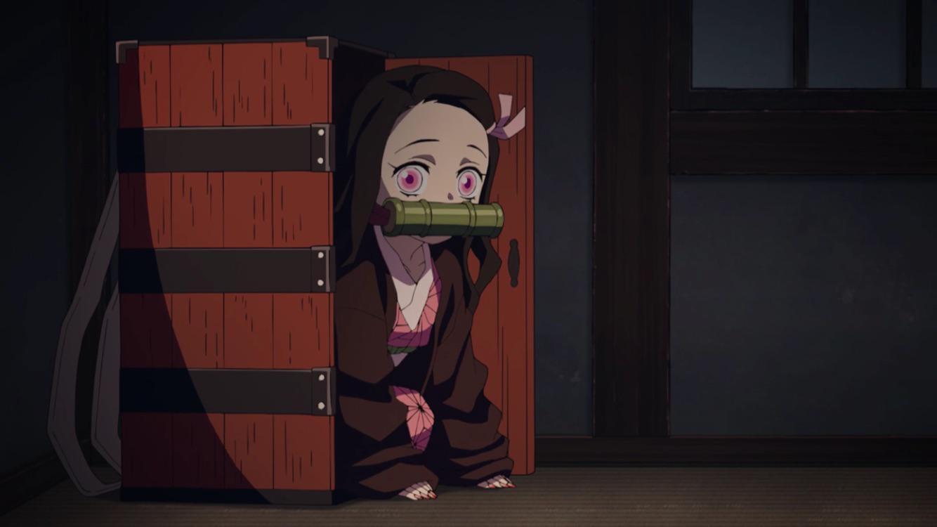 Nezuko from Demon Slayer crawling out of her wooden box.