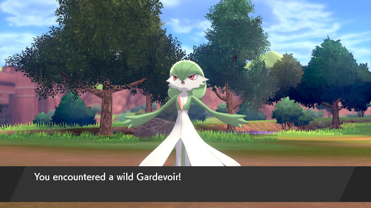 A wild Gardevoir appears! It's a white and green humanoid plant Pokémon.