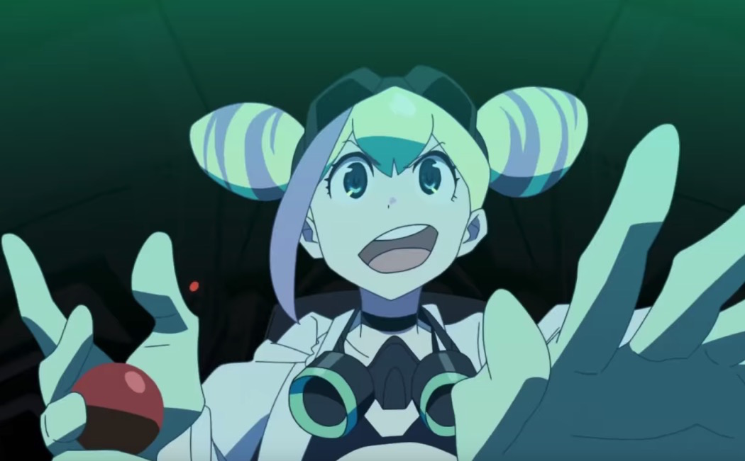 Lucia Fex from Promare smiling while moving a joystick and pressing buttons. She has blonde hair in two tight buns and is wearing a gas mask loosely around her neck.