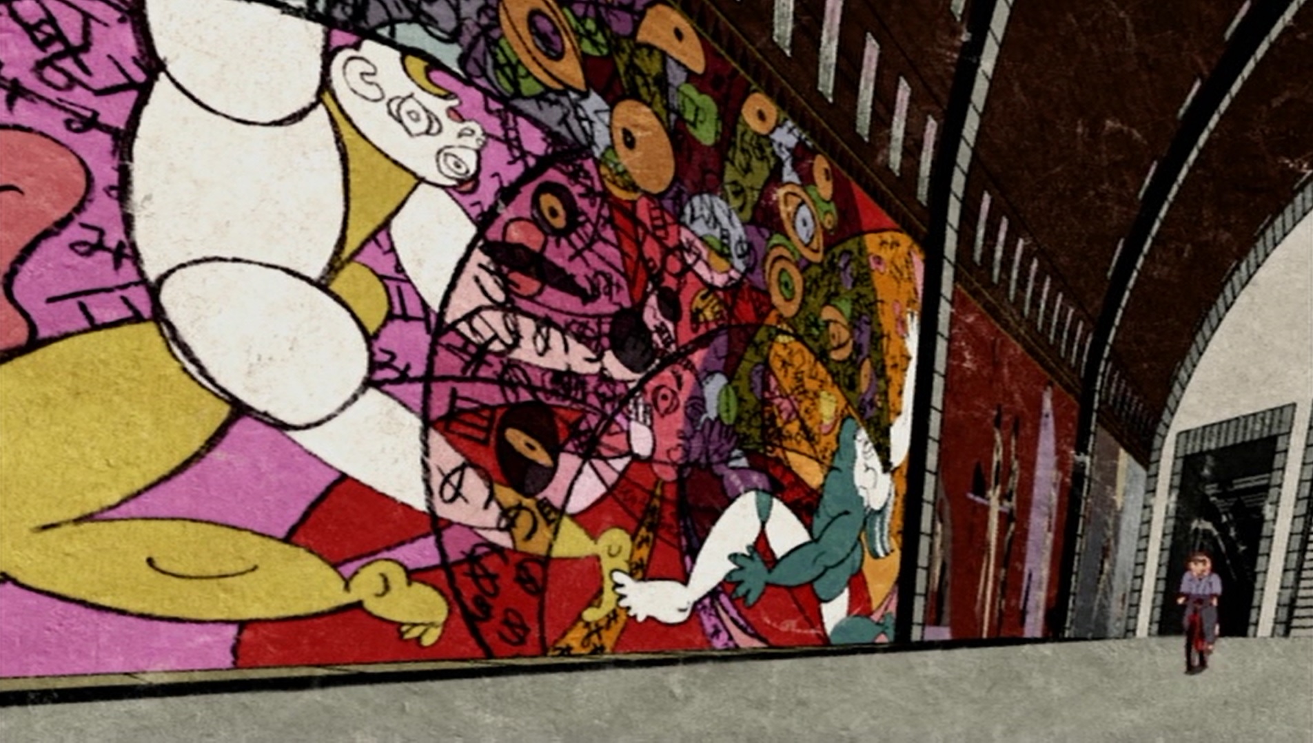 Abstract art mural in a train station with a boy on a bicycle riding backwards on the platform