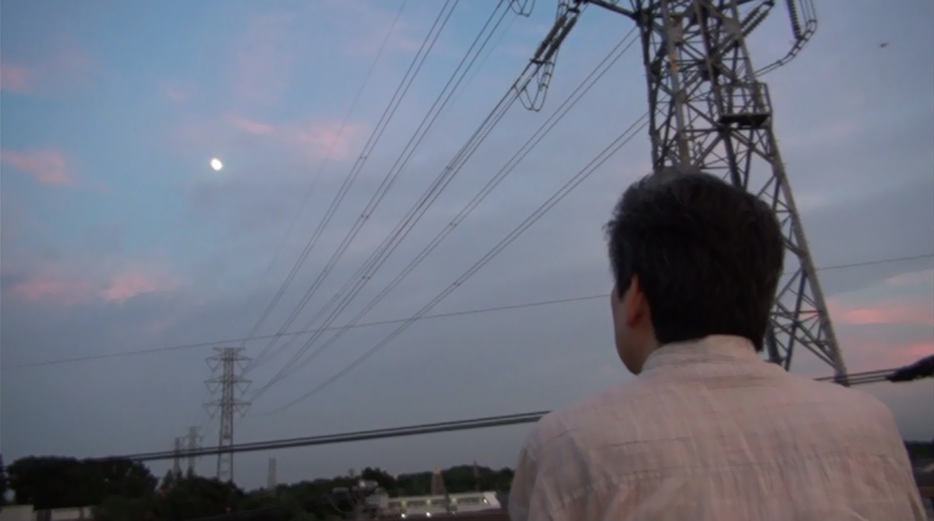 Isao Takahata stares at the moon from the rooftop of Studio Ghibli 7.