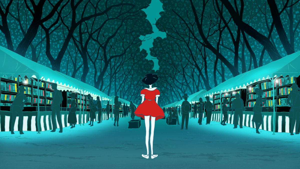 The girl in the red dress from The Night Is Short, Walk on Girl standing in front of rows of books at an outdoor market